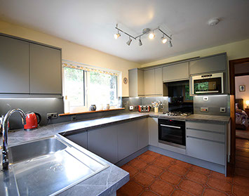 Auld Orwell Cottage contains an open plan kitchen with oven hob microwave kettle and toaster