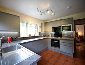 Auld Orwell Cottage contains an open plan kitchen with oven hob microwave kettle and toaster