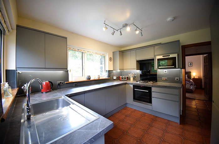 Auld Orwell Cottage contains an open plan kitchen with oven hob microwave kettle and toaster