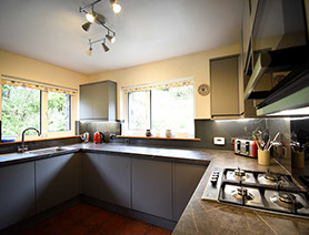 Auld Orwell Cottage kitchen contains oven hob miceowave dishwasher and washing machine