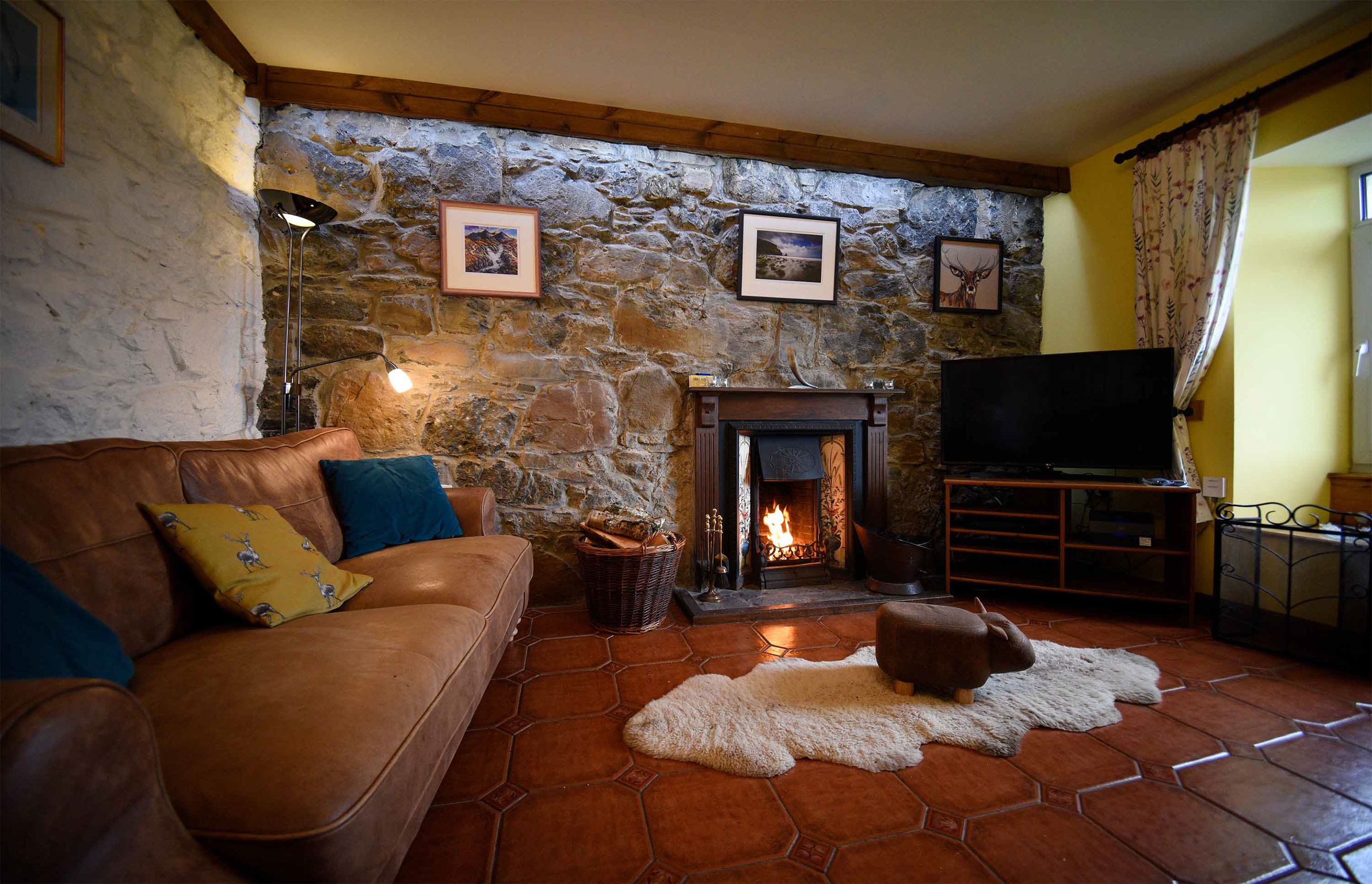 Enjoy open fireplace and cosy living room at Auld Orwell Cottage Self Catering Accommodation in Waternish